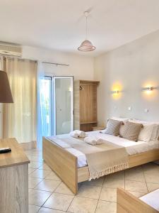 a bedroom with a large bed in a room at Villa Elva in Ammoudia