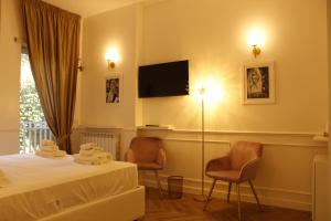 Μια τηλεόραση ή/και κέντρο ψυχαγωγίας στο Don Raffaele Resort Roma - Guest House