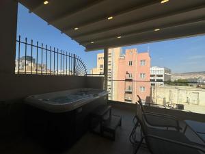 a large bathroom with a tub and a large window at BlueMotion - PortSuite 4A in Piraeus