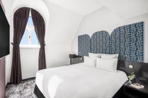 Voodi või voodid majutusasutuse Nemzeti Hotel Budapest - MGallery Collection toas