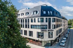 a hotel office building with a blue roof at Hotel Opera in Białystok