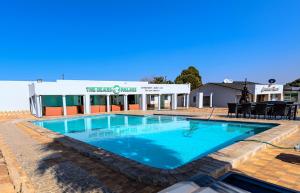 a large swimming pool in front of a building at Carolina Resort in Carolina