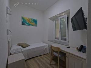 Giường trong phòng chung tại Hotel Week End