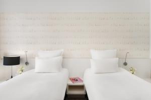 Voodi või voodid majutusasutuse Nemzeti Hotel Budapest - MGallery Collection toas