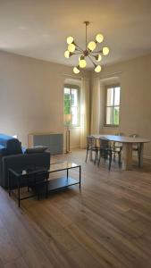 a living room with a couch and a table at Villa Tosi - Luxury Apartments in Villa Veneta in Tregnago