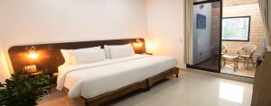 Ένα ή περισσότερα κρεβάτια σε δωμάτιο στο Hotel Acqua Medellín