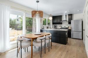 a kitchen with a wooden table and some chairs at Austin Oasis Zilker, Downtown, Pool, 3 Bedroom in Austin