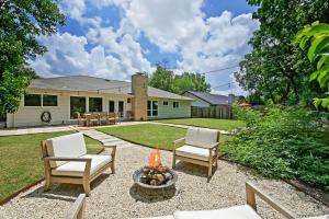 a backyard with two chairs and a fire pit at Austin Oasis Zilker, Downtown, Pool, 3 Bedroom in Austin