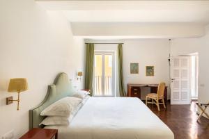 Łóżko lub łóżka w pokoju w obiekcie Residenza Torre Vecchiarelli - apt 4