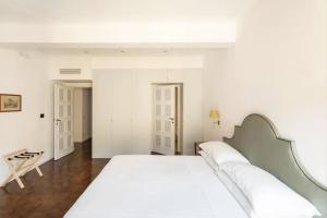 Łóżko lub łóżka w pokoju w obiekcie Residenza Torre Vecchiarelli - apt 4