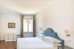 Łóżko lub łóżka w pokoju w obiekcie Residenza Torre Vecchiarelli - apt 4