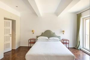 Łóżko lub łóżka w pokoju w obiekcie Residenza Torre Vecchiarelli - apt 4