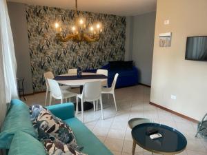 a living room with a couch and a table at La Bomboniera in Cervia