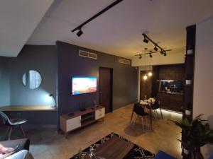 a living room with a flat screen tv on a wall at R Apartamento de lujo en Valencia 1 Hab in Valencia