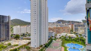 a view of a city with a tall building at Piso Atrium de 1 dormitorio in Villajoyosa