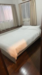 Letto o letti in una camera di Jl千住別荘