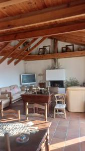 a living room with a table and a couch at A casa di Francesca in Marignana