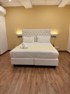 Postel nebo postele na pokoji v ubytování Hotel Veronese