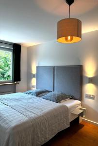 Ένα ή περισσότερα κρεβάτια σε δωμάτιο στο Weissach Apartments