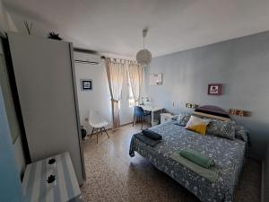 Postel nebo postele na pokoji v ubytování Duplex en Huelva a 15 minutos en coche de las mejores playas de España
