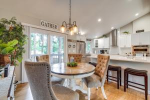 a kitchen and dining room with a table and chairs at Bremerton Home with Fire Pit Near Parks and Museums in Bremerton