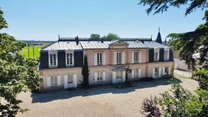 an aerial view of a large brick house with windows at Maison chaleureuse de 4 à 12 personnes in Neuville-aux-Bois