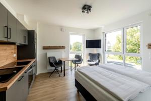 Giường trong phòng chung tại VR-Serviced Apartments Würzburg