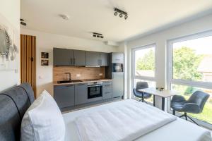 Nhà bếp/bếp nhỏ tại VR-Serviced Apartments Würzburg
