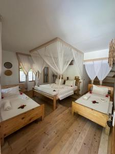 Ένα ή περισσότερα κρεβάτια σε δωμάτιο στο Tsunami Village