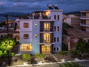 an aerial view of a white house at night at Magical Seaside Town Boutique Apts 2 in Kyparissia