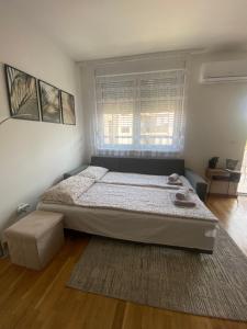 Postel nebo postele na pokoji v ubytování Angel Apartment