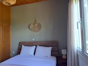 Ένα ή περισσότερα κρεβάτια σε δωμάτιο στο Holiday Home Orfanos