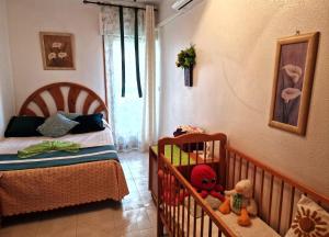 Postel nebo postele na pokoji v ubytování Apartamento Berry Playa Naufragos + 37 fotografií