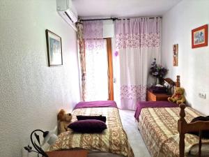 Postel nebo postele na pokoji v ubytování Apartamento Berry Playa Naufragos