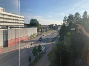 a person taking a picture of a city street at Rovaniemi center apartment in Rovaniemi