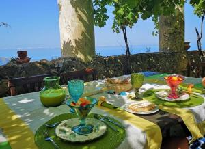 a table with plates of food on top of it at Il Castello di San Sergio in Centola