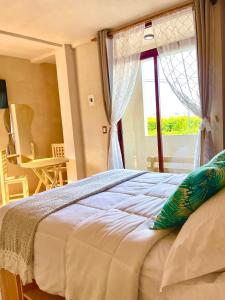 Postel nebo postele na pokoji v ubytování Hotel Casa Maakjä