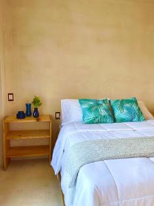 Postel nebo postele na pokoji v ubytování Hotel Casa Maakjä