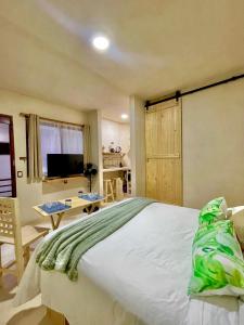 Postel nebo postele na pokoji v ubytování Hotel Casa Maakjä