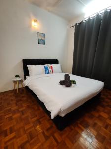 Postel nebo postele na pokoji v ubytování Busybee Breezy Stay Homestay