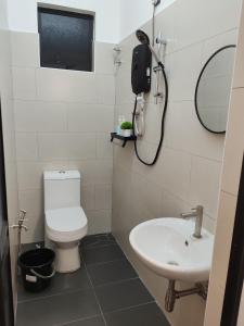 Koupelna v ubytování Busybee Breezy Stay Homestay + 16 fotografií