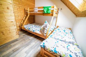 Postel nebo postele na pokoji v ubytování Prázdninový dům - Apartmány Vltavice