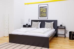 Letto o letti in una camera di The Factory Flat