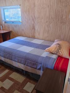 Postel nebo postele na pokoji v ubytování Hospedaje Martita Patagonia