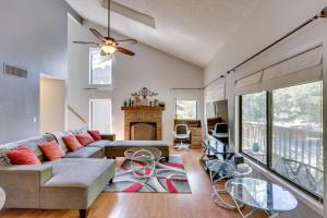a living room with a couch and a fireplace at Bryce Resort Getaway with Sauna, 1 Mi to Lake Beach! in Basye