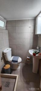 a bathroom with a toilet and a sink at Siesta Luxury Apartment in Heraklio +12 photos