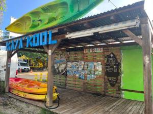 a seafood stand with a surfboard on top of it at Le Gosier Coastal Residence in Le Gosier