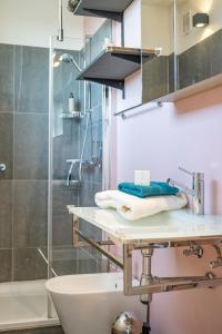 a bathroom with a sink and a shower at Zevende hemel in Zeebrugge