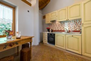 A kitchen or kitchenette at Casa Monica Ledro Attico