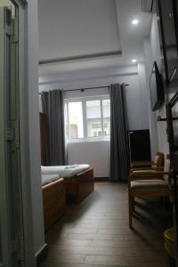Postel nebo postele na pokoji v ubytování 102 House